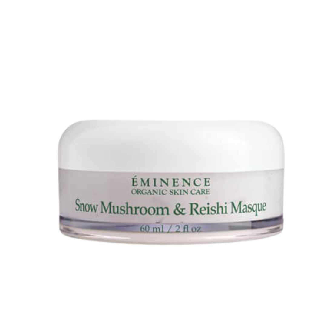 Close-up of Eminence Snow Mushroom & Reishi Masque in a white jar, featuring natural ingredients for hydrating and plumping the skin.